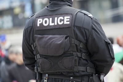 detail of a police officer on the street.