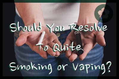 Unrecognizable woman holding vape and tobacco cigarette in hands.
