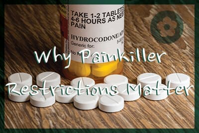 Close photo of prescription bottle for Hydrocodone tablets and pills on wooden table for opioid epidemic illustration