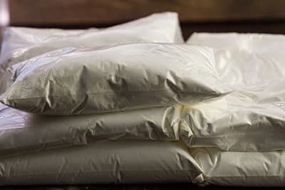 Stash of meth drugs on table in transparent bags