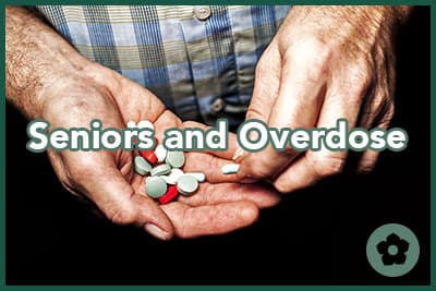 Heap of colorful medical pills in senior male hands closeup.